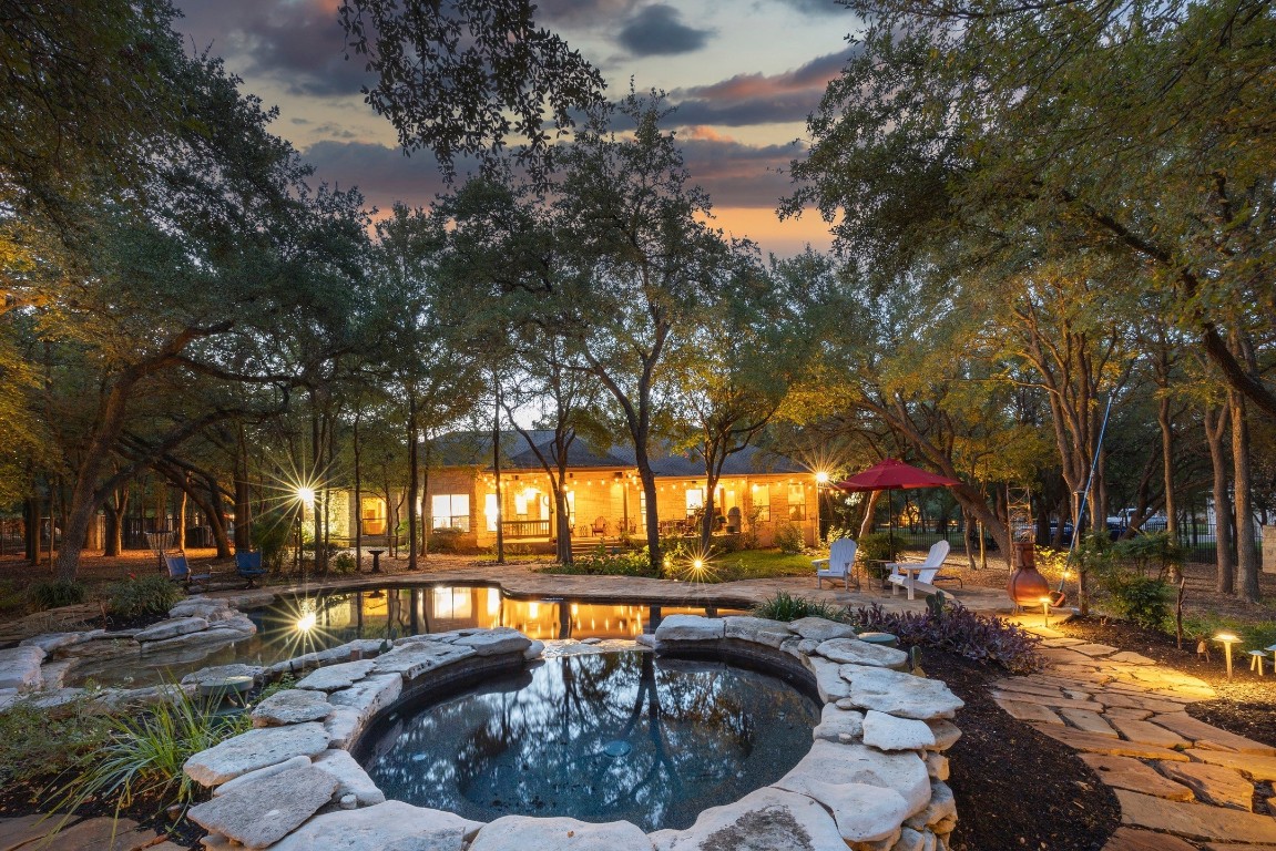 a view of swimming pool with outdoor seating and outdoor seating