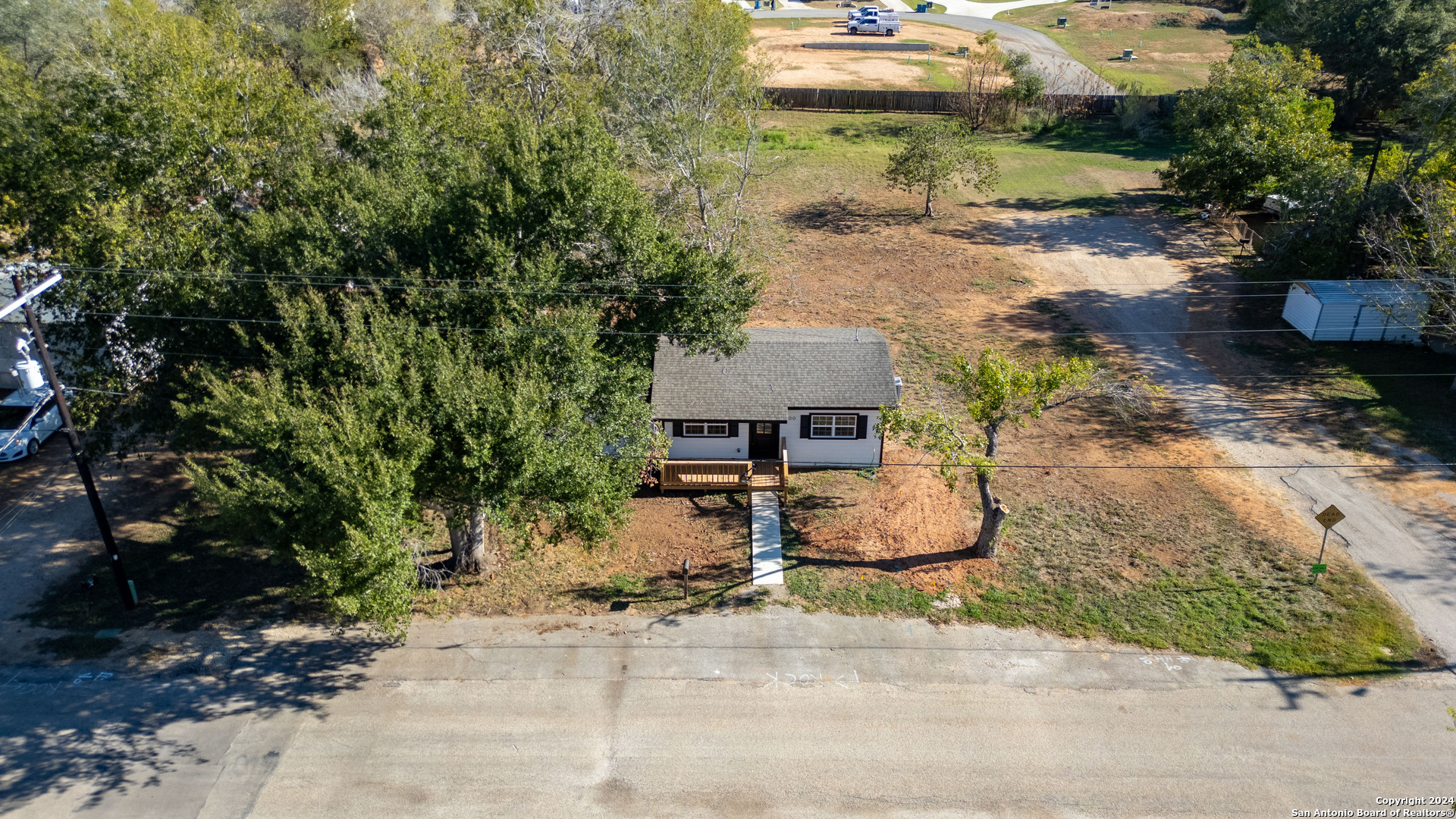 a backyard of a house with yard and garage