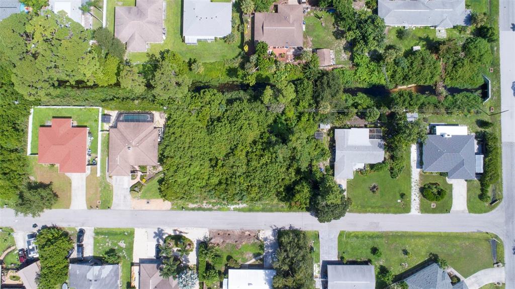 an aerial view of a house with a garden