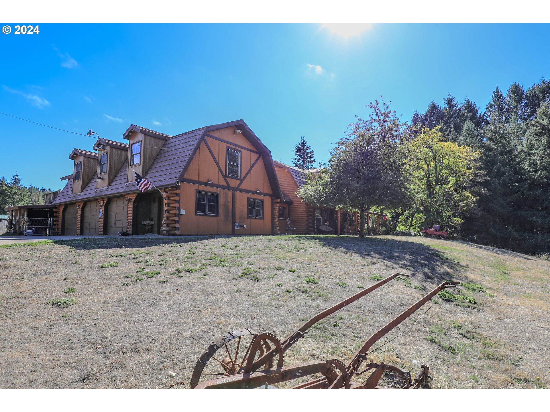 a view of a wooden house with a yard