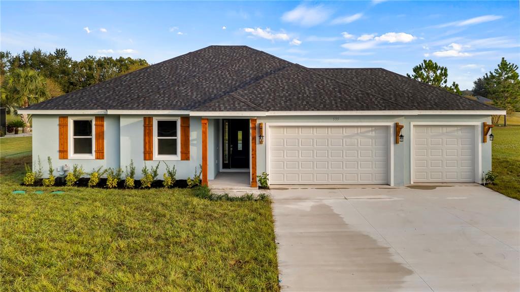 front view of house with a yard