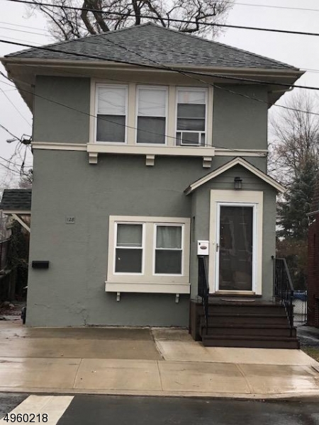 a view of a house with a door and a window