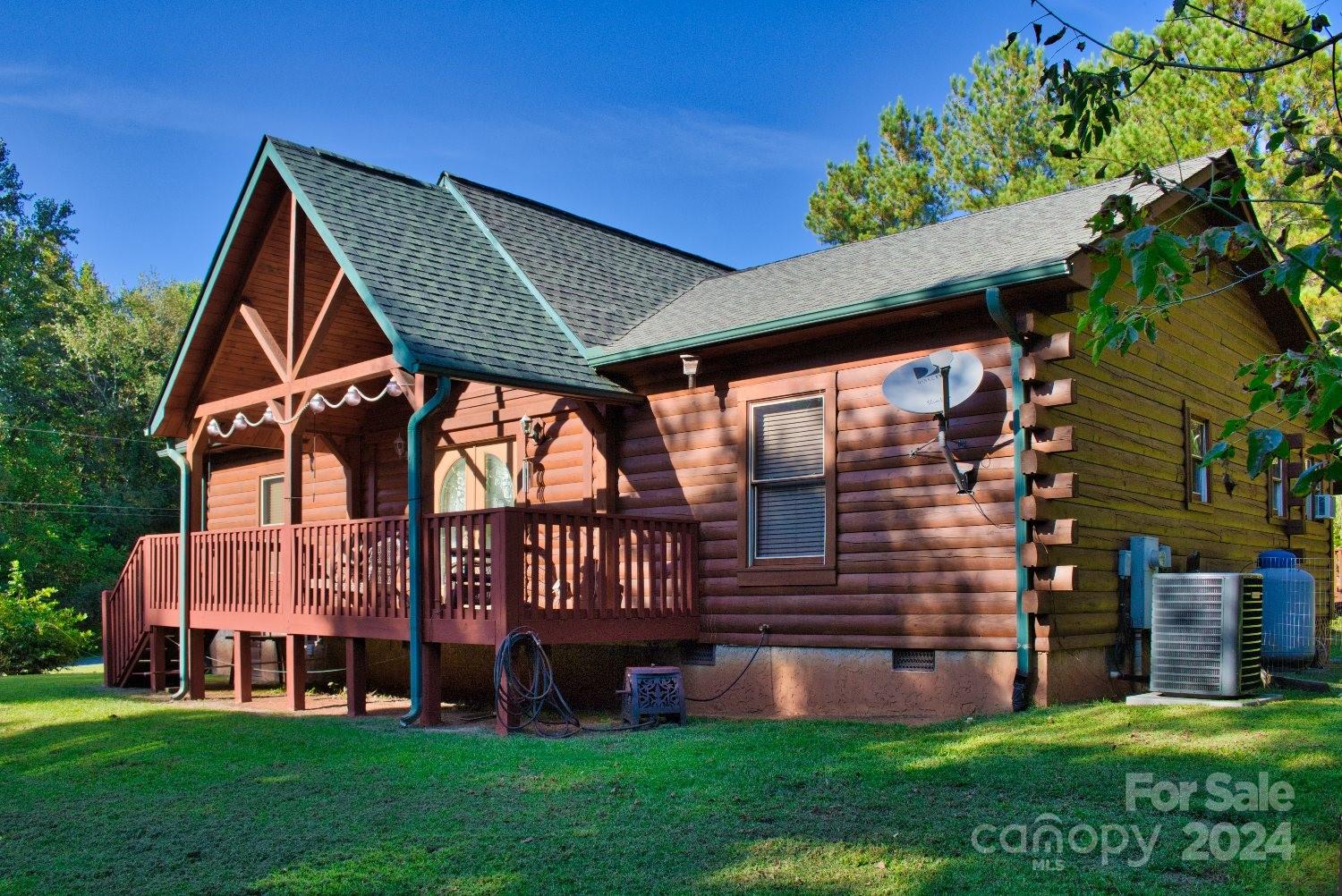 a front view of a house with garden and deck