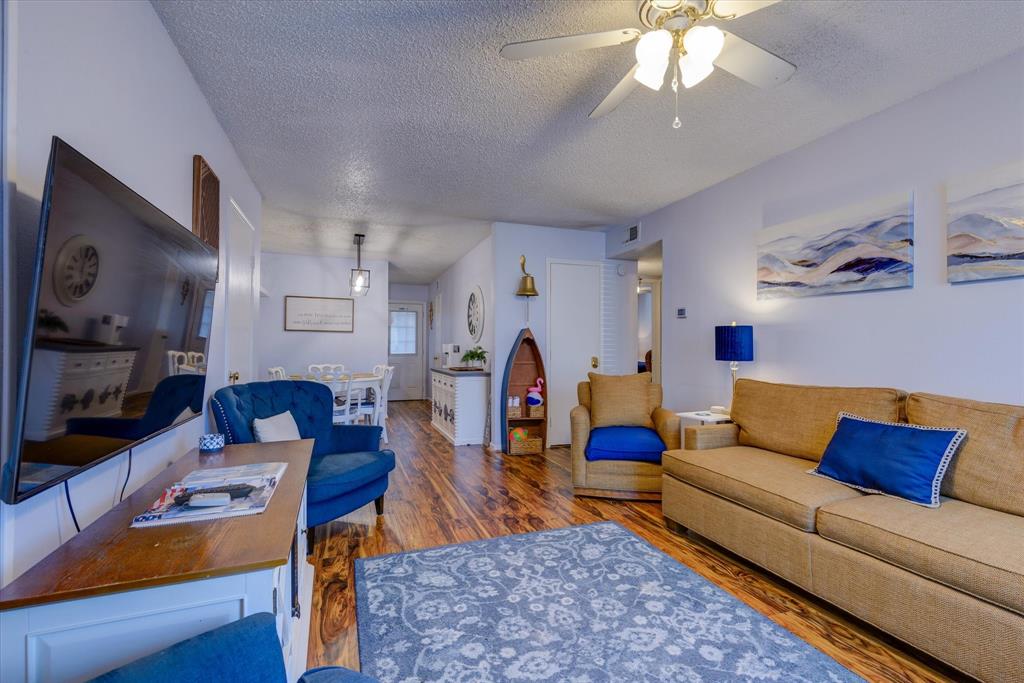 a living room with furniture fireplace and a flat screen tv