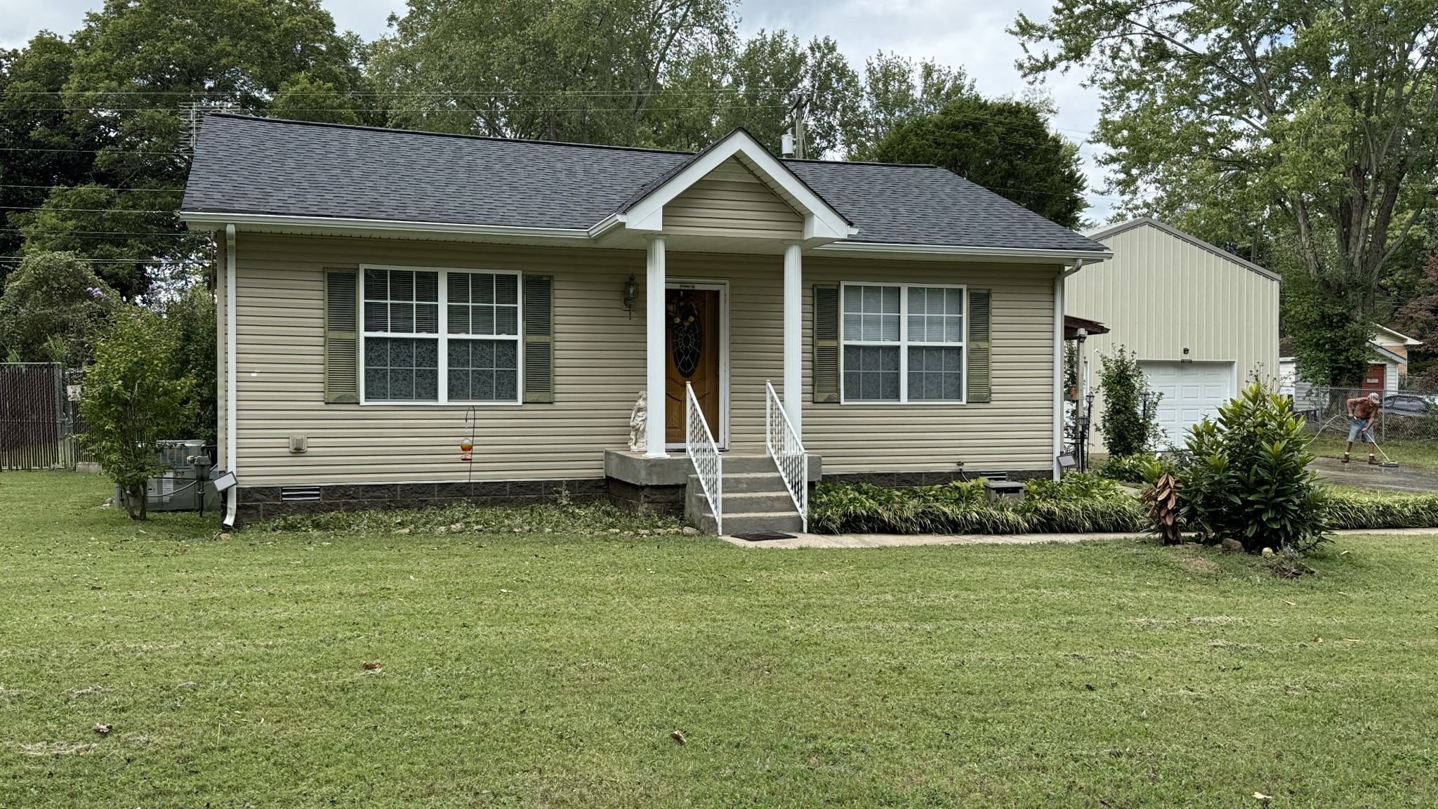 a front view of a house with garden