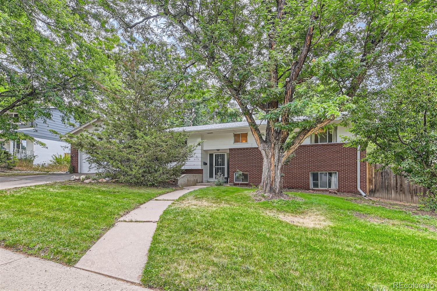 front view of a house with a yard