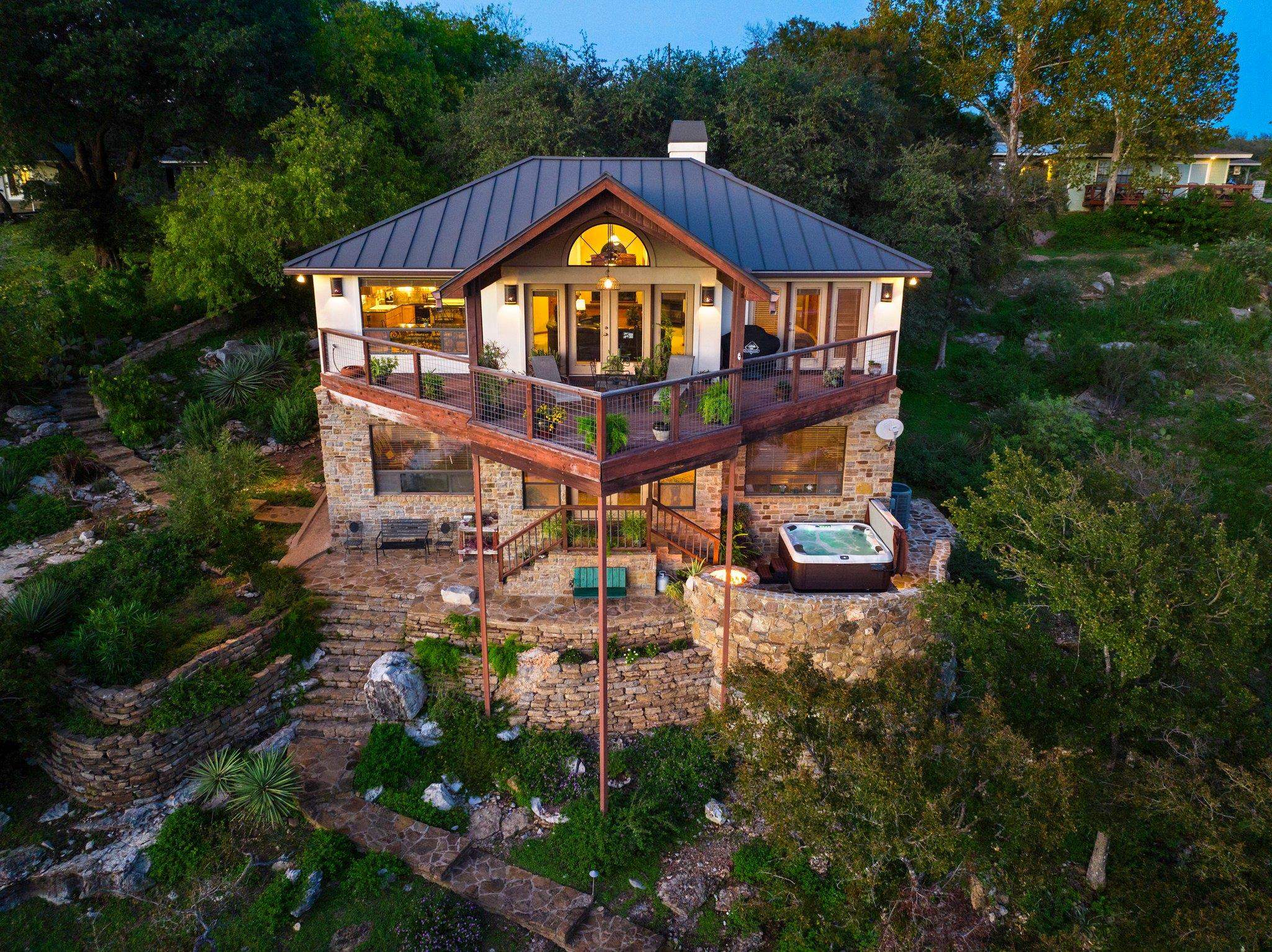 an aerial view of a house with a big yard