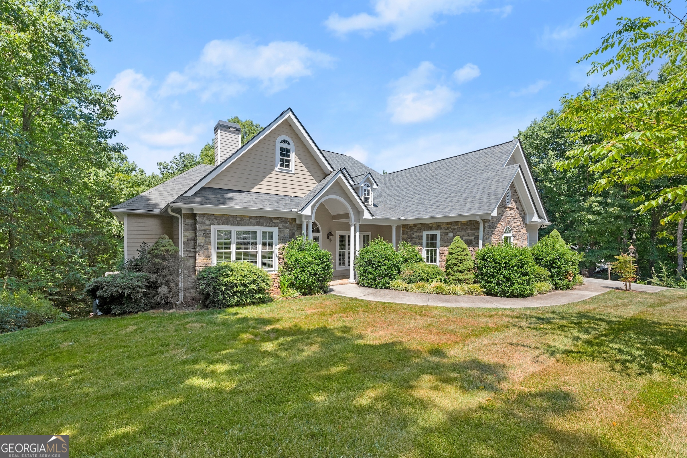 a front view of a house with a yard