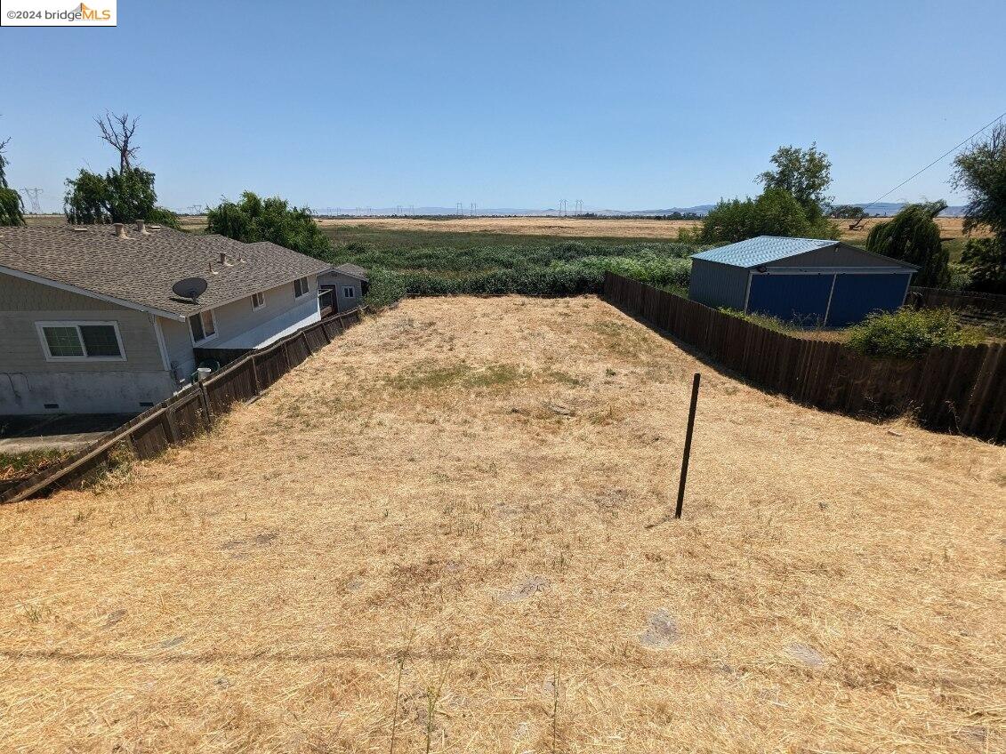 a view of swimming pool with a yard