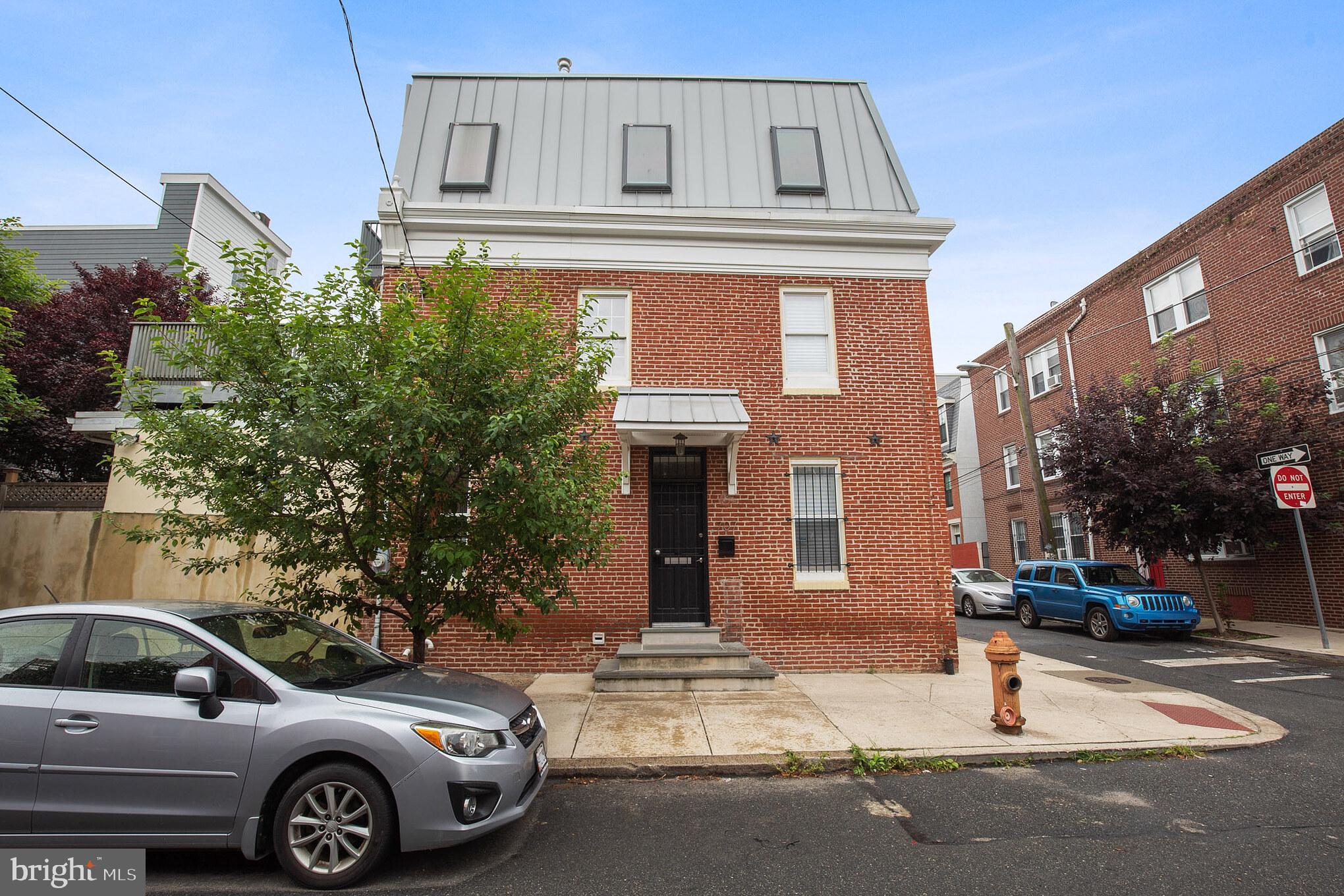 a front view of a house with parking