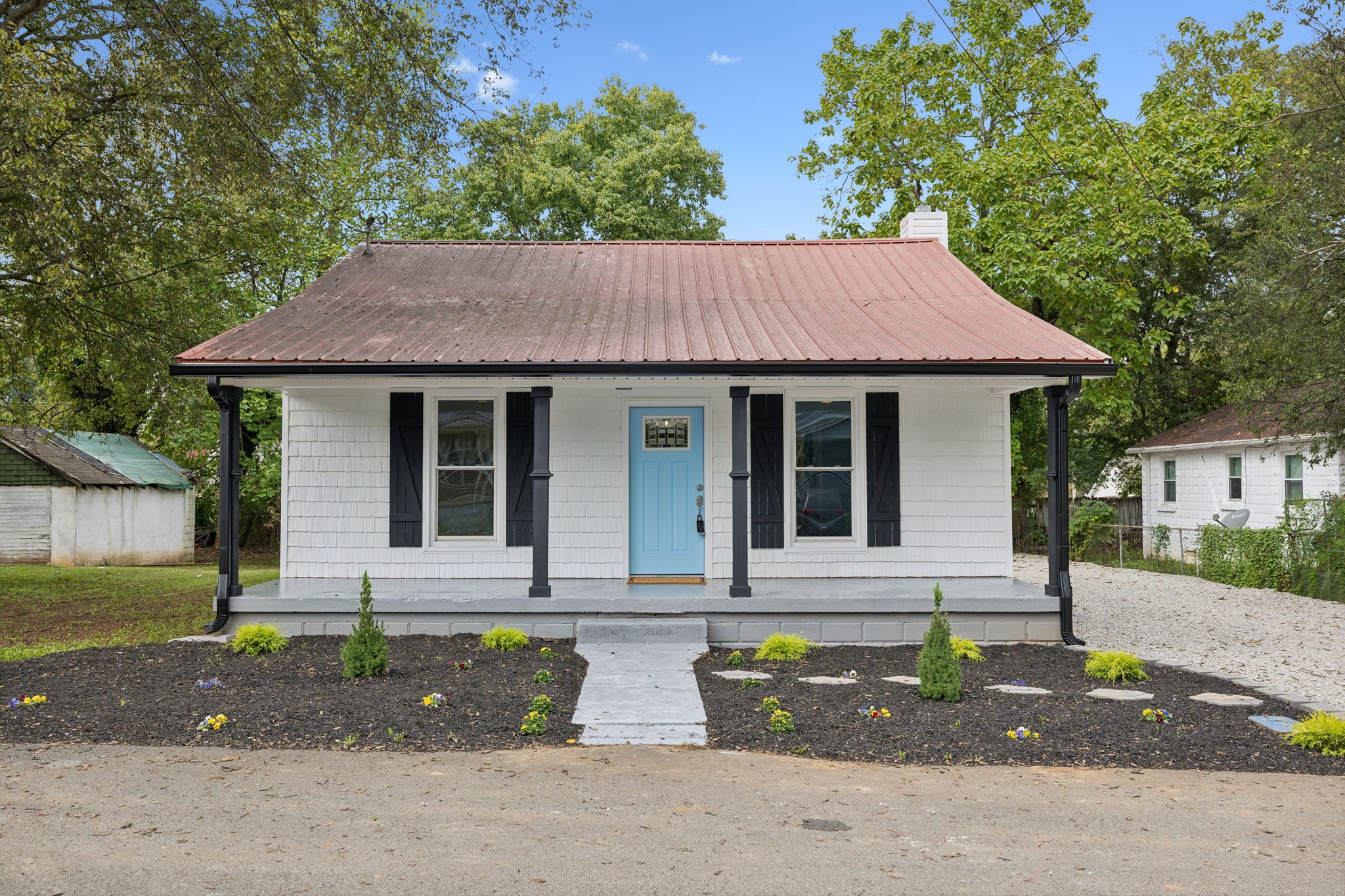 a front view of a house with garden