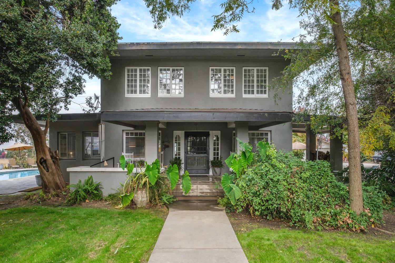 a front view of a house with garden