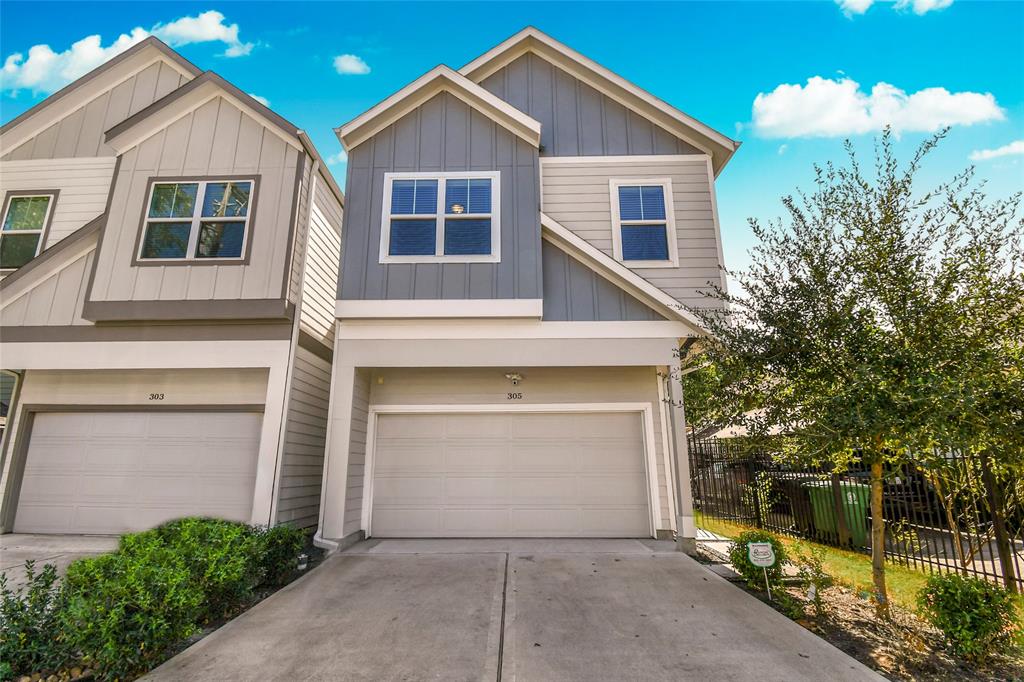 a front view of a house with garage