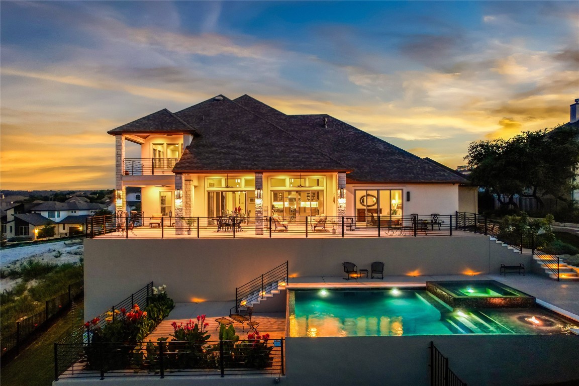 a view of swimming pool and outside seating area