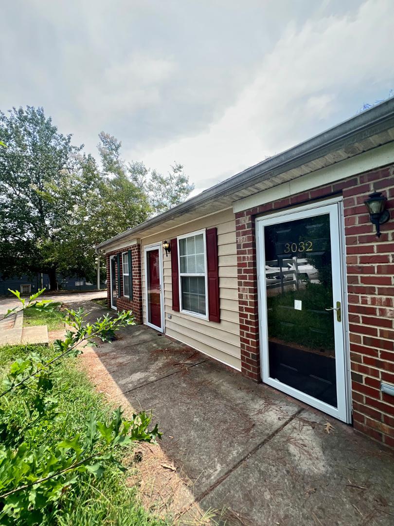 a view of a house with swimming pool and porch with furniture