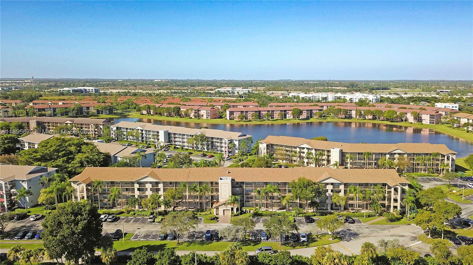 an aerial view of residential building and lake view