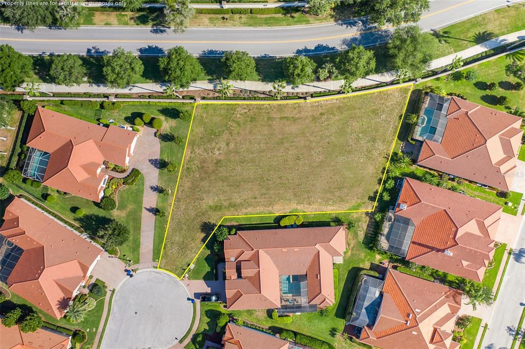 an aerial view of house with a yard and lake view