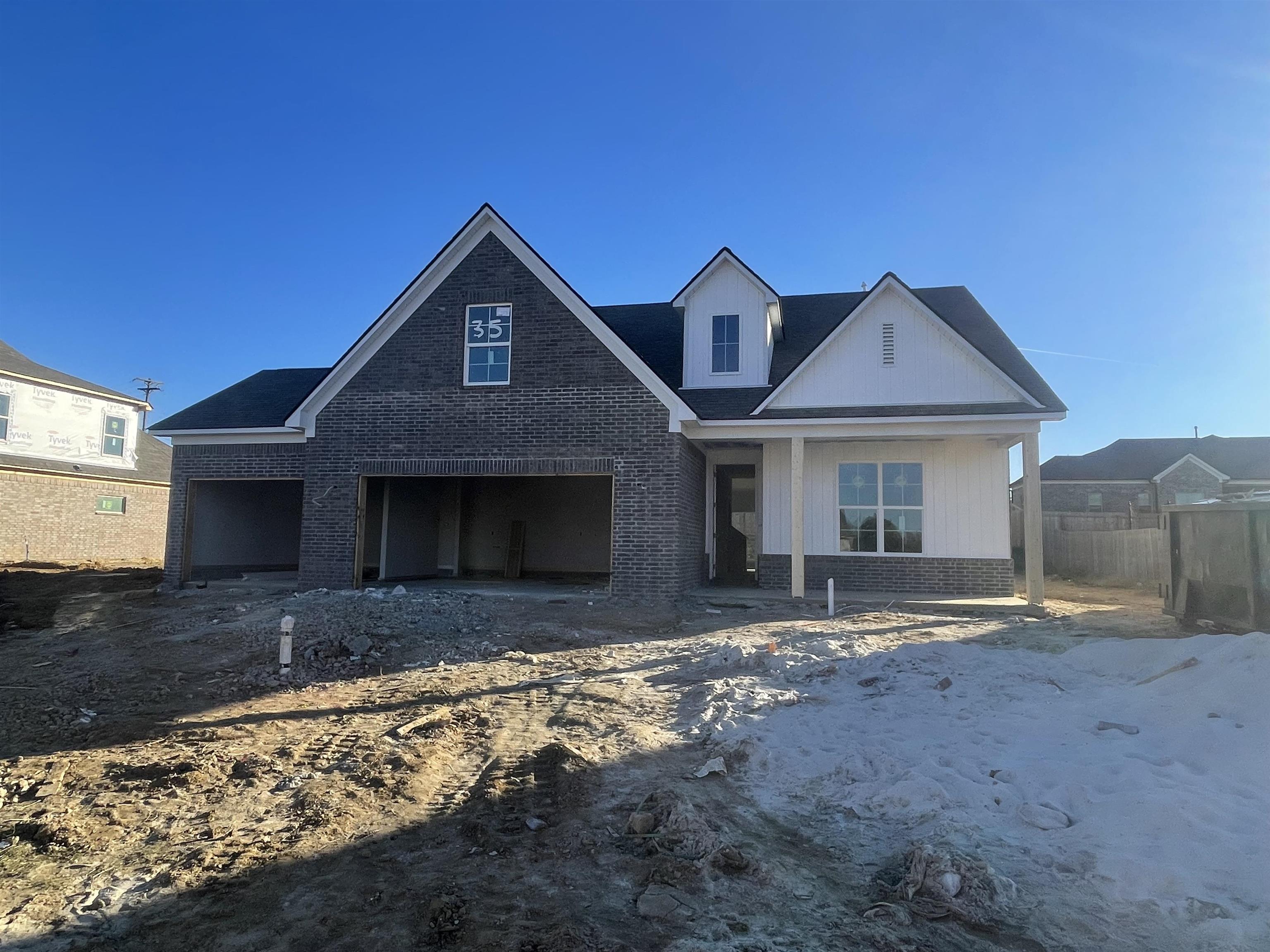 View of front facade featuring a garage