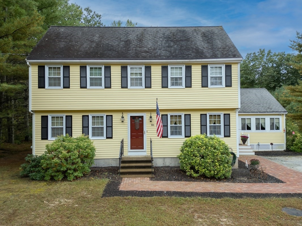 a front view of a house with yard