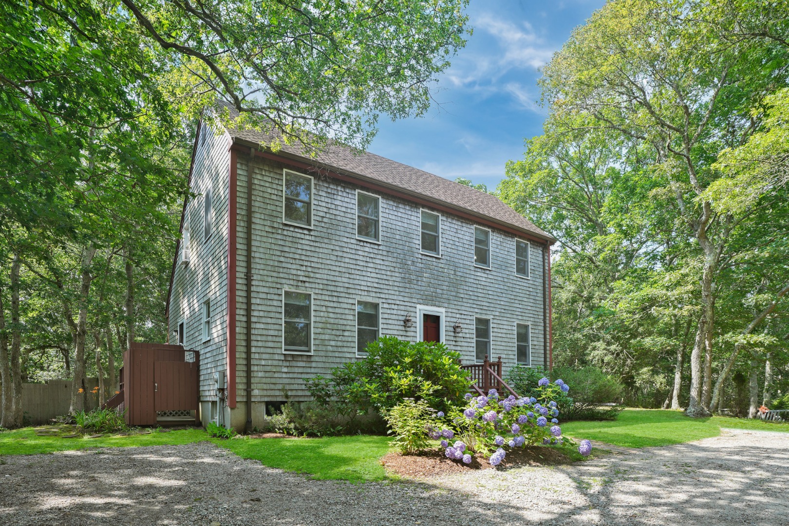 a front view of a house with garden