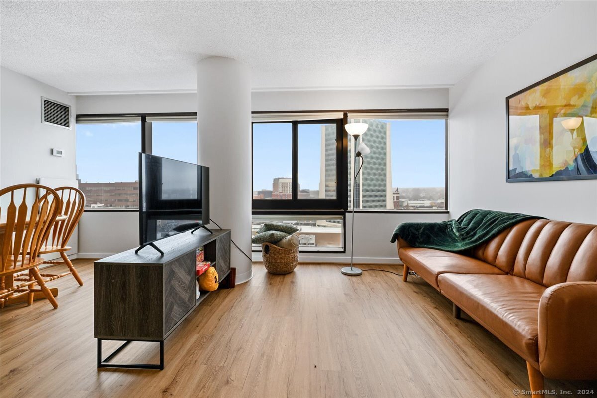 a living room with furniture and a flat screen tv