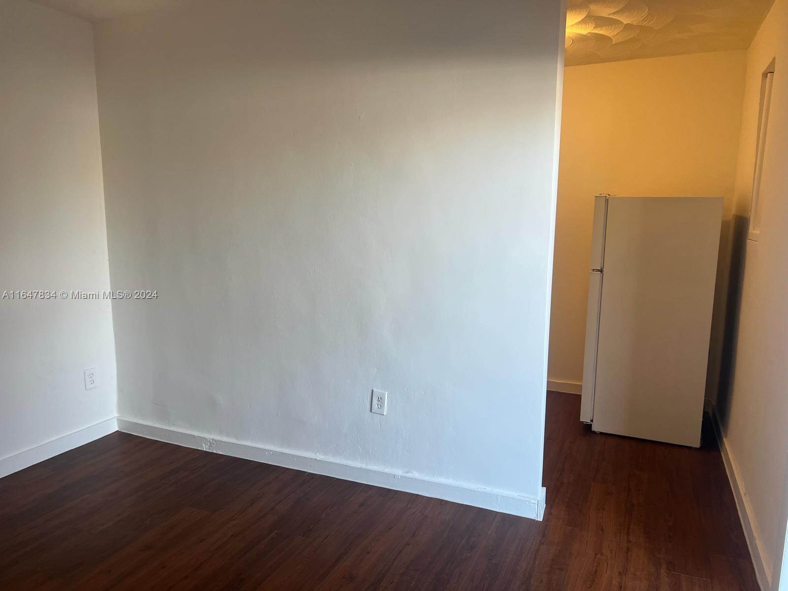 a view of a small space with wooden floor