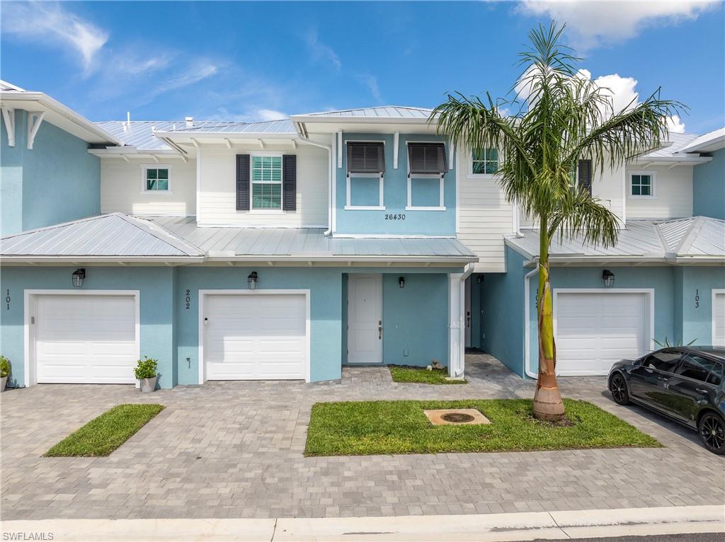 View of property featuring a garage