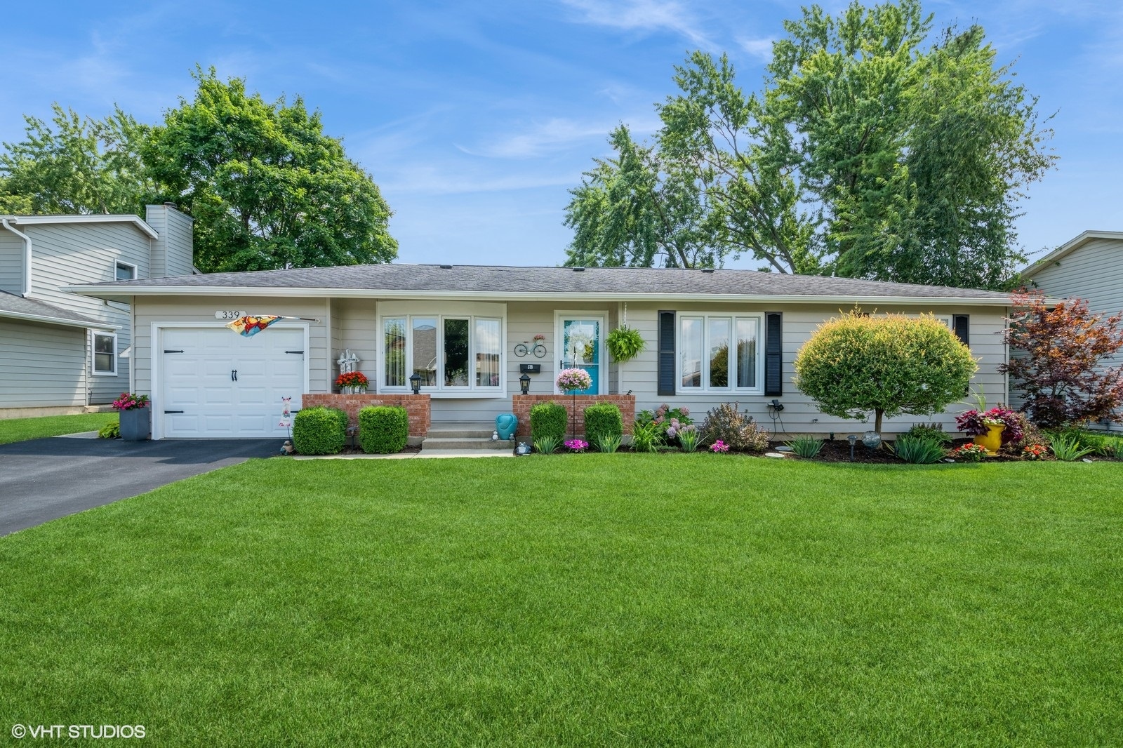 a view of a house with backyard sitting area and garden