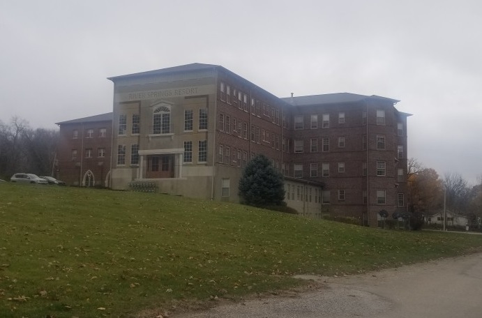 a big house with a big yard and large trees