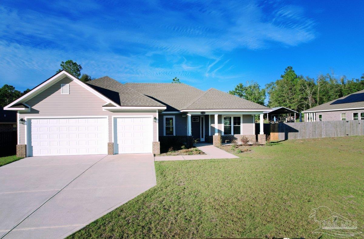 a front view of a house with a yard