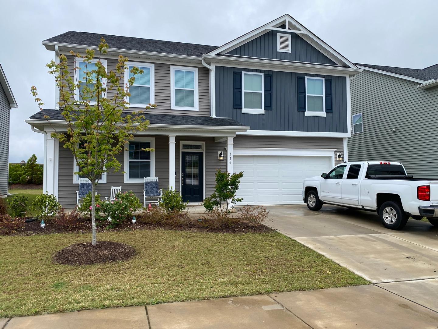 a front view of a house with a yard