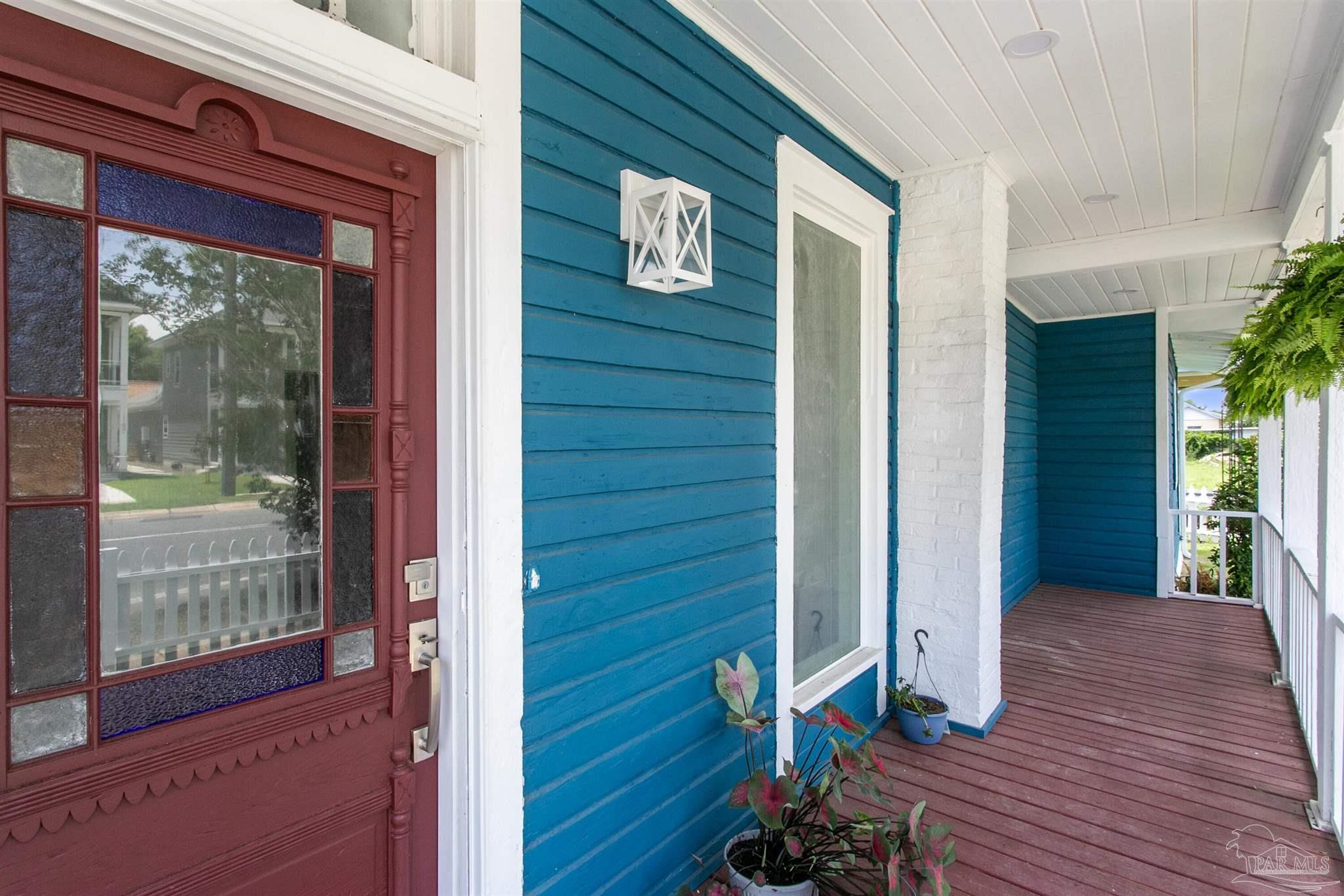 a view of front door of house with wooden floor