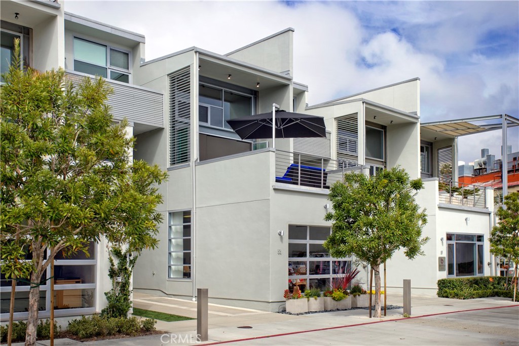 a view of a building with a tree front of house