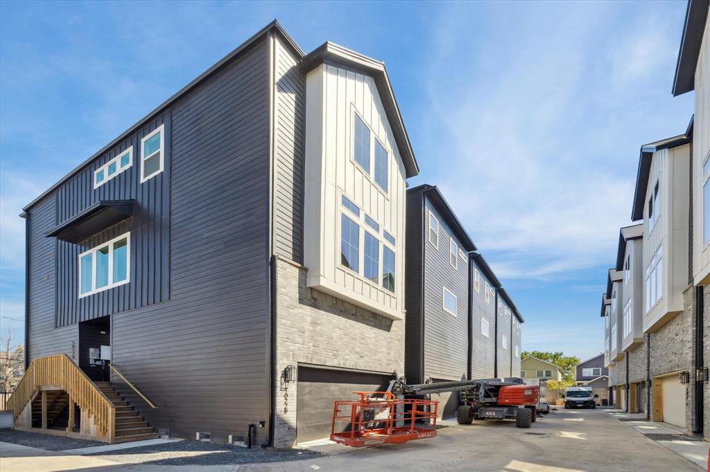 a view of a building with car parked