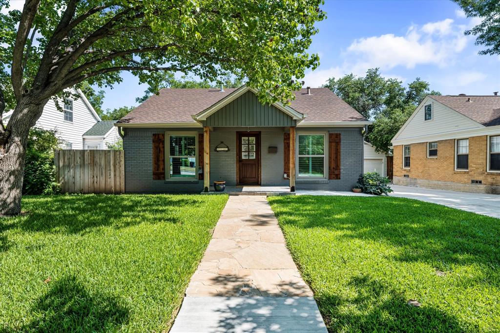 front view of a house with a yard