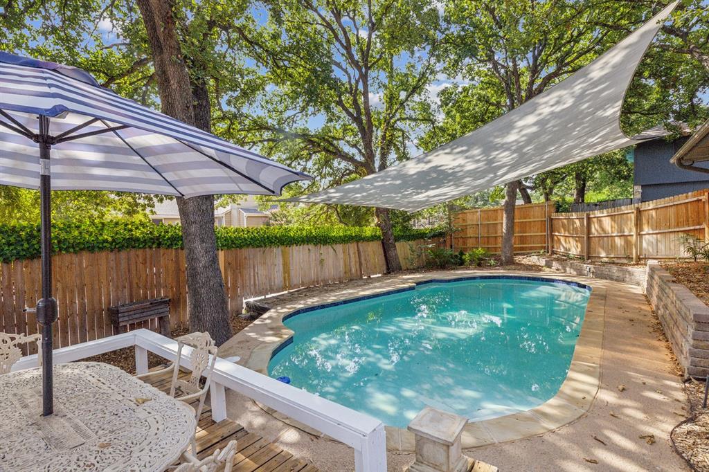 a view of a backyard with a patio