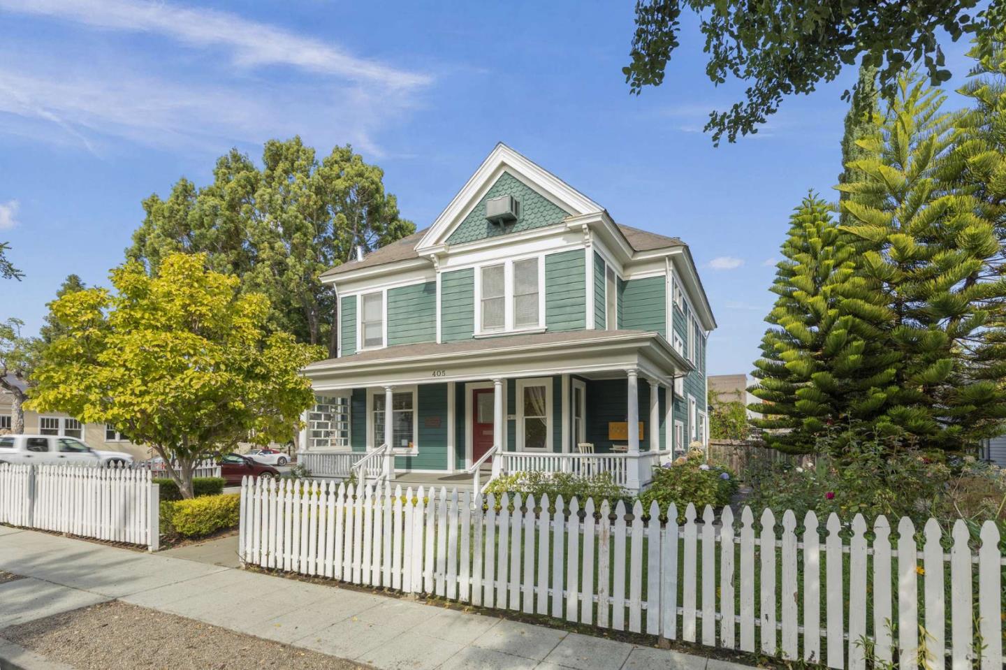 a front view of a house with a garden