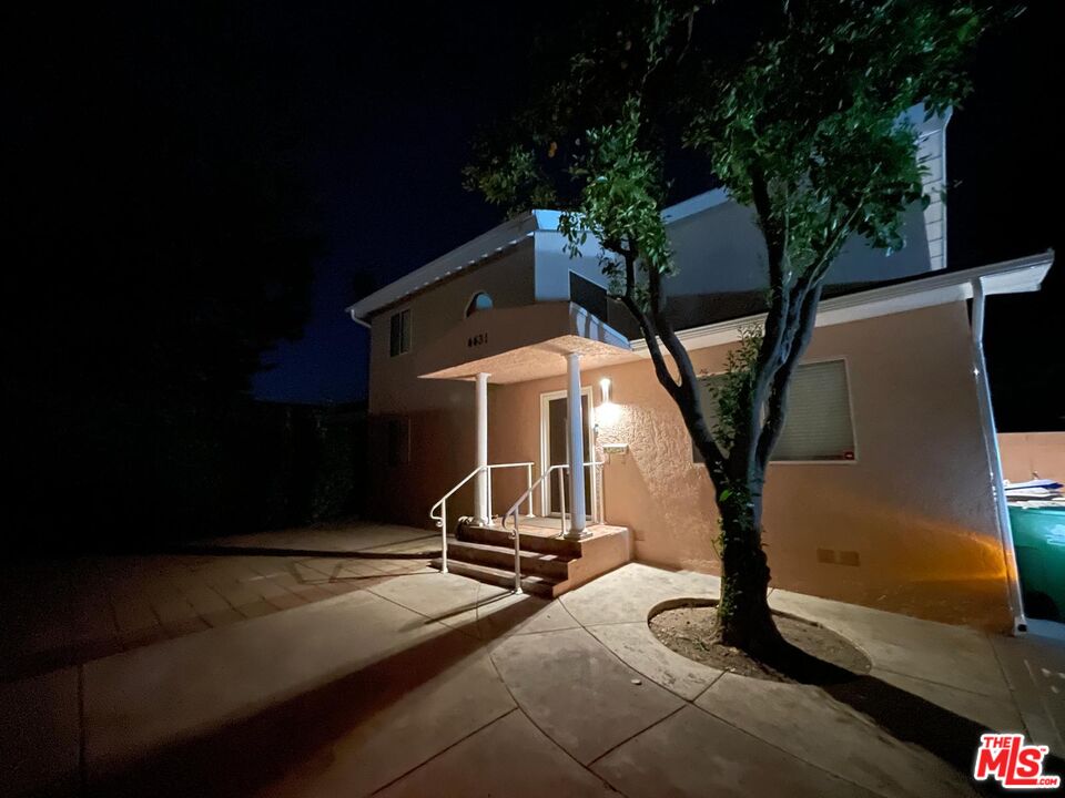 a house with trees in front of it