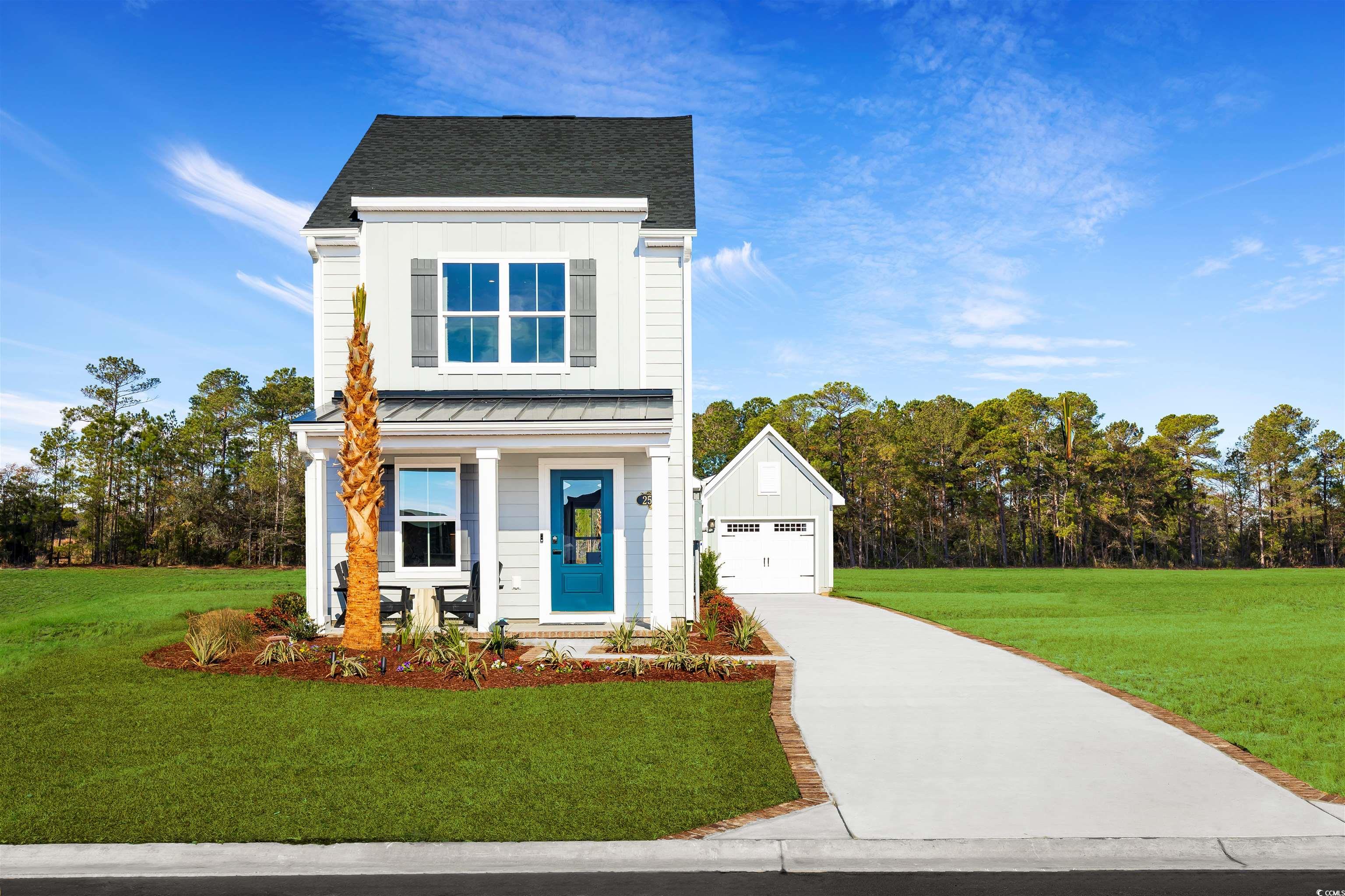 View of front of property featuring a garage, a fr