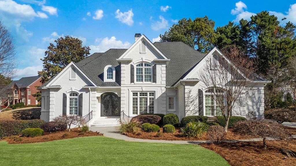 a front view of a house with a yard