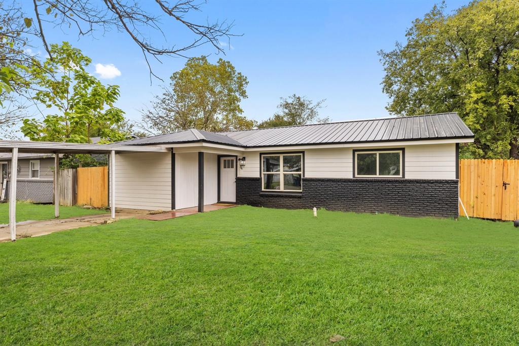 front view of a house with a yard