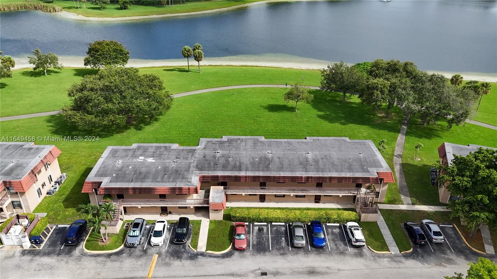 an aerial view of a house with garden space and street view