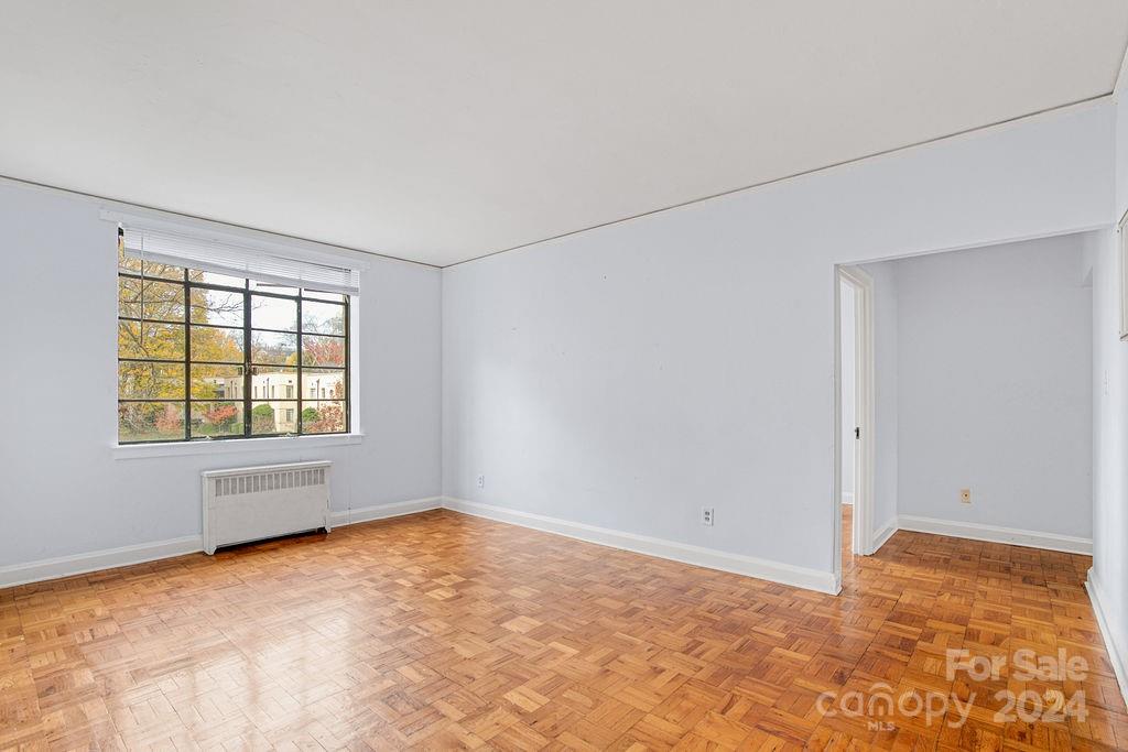 a view of an empty room with a window