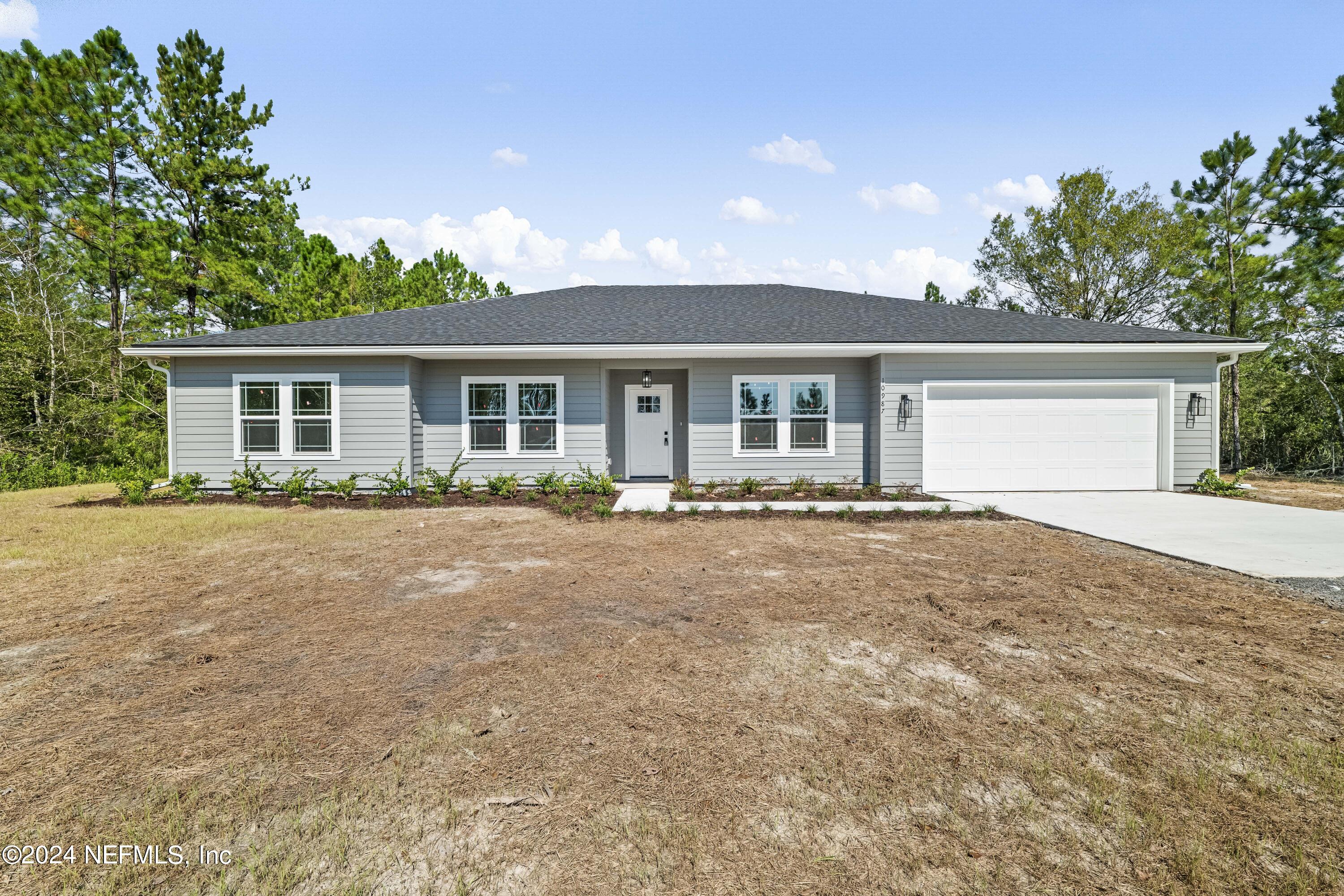 front view of a house with a yard