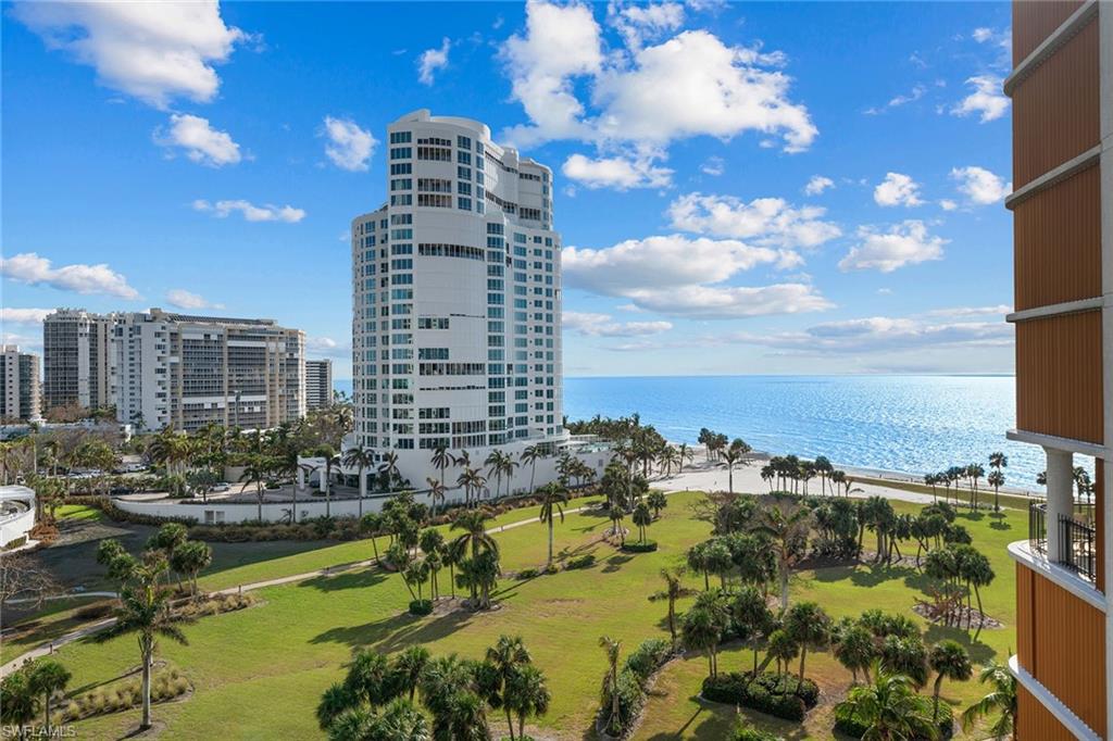 a view of water with tall building