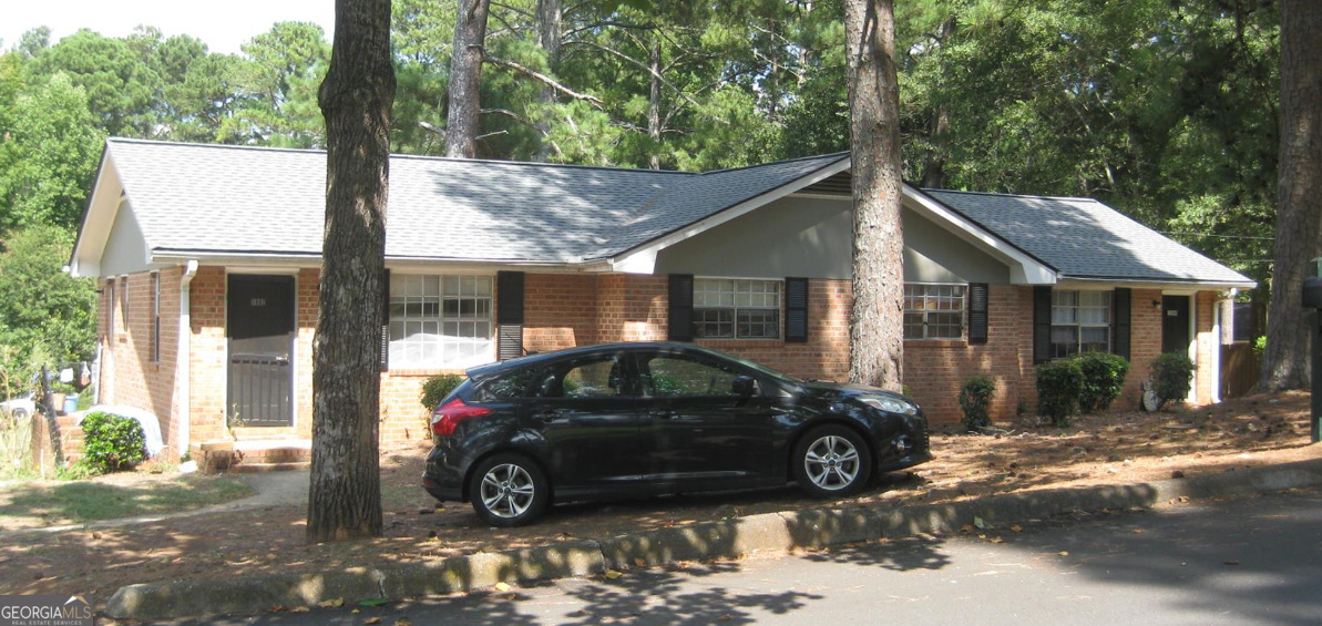 a car parked in front of a house