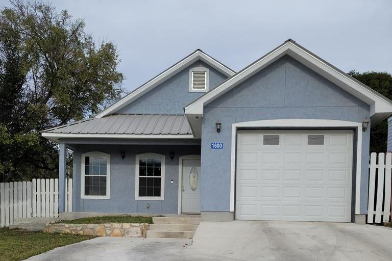 a front view of a house with a garage