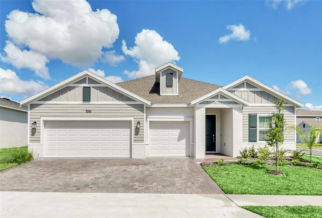 a front view of a house with yard