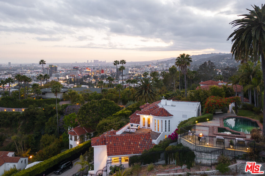 an aerial view of residential houses and outdoor space