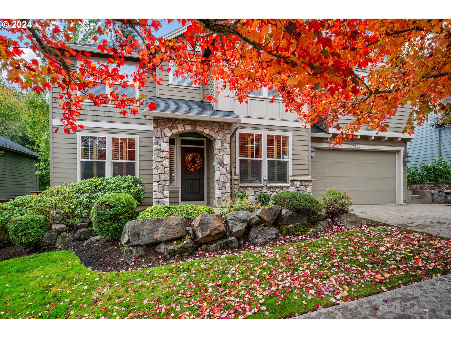 a front view of house with yard and outdoor seating